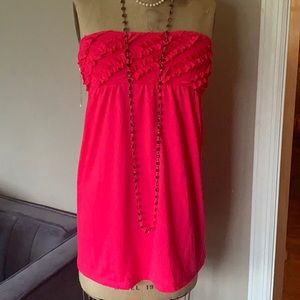 Adorable pink shirt with ruffle top